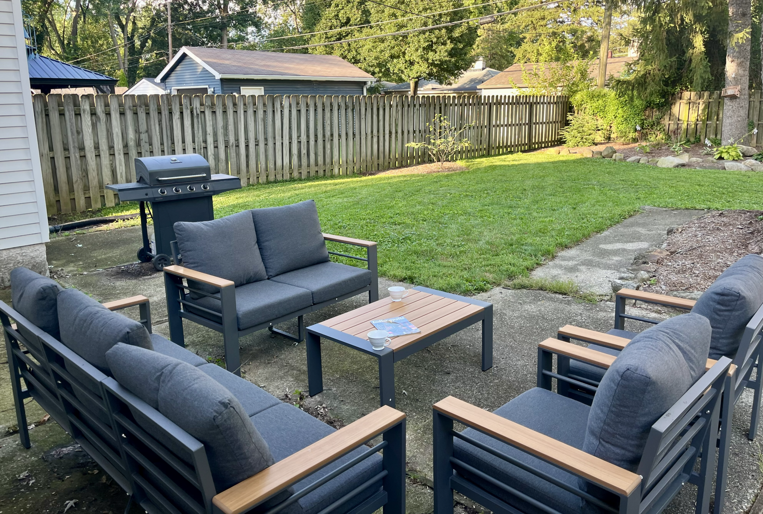Private fenced backyard with outdoor seating at Rosslyn Retreat in Indianapolis